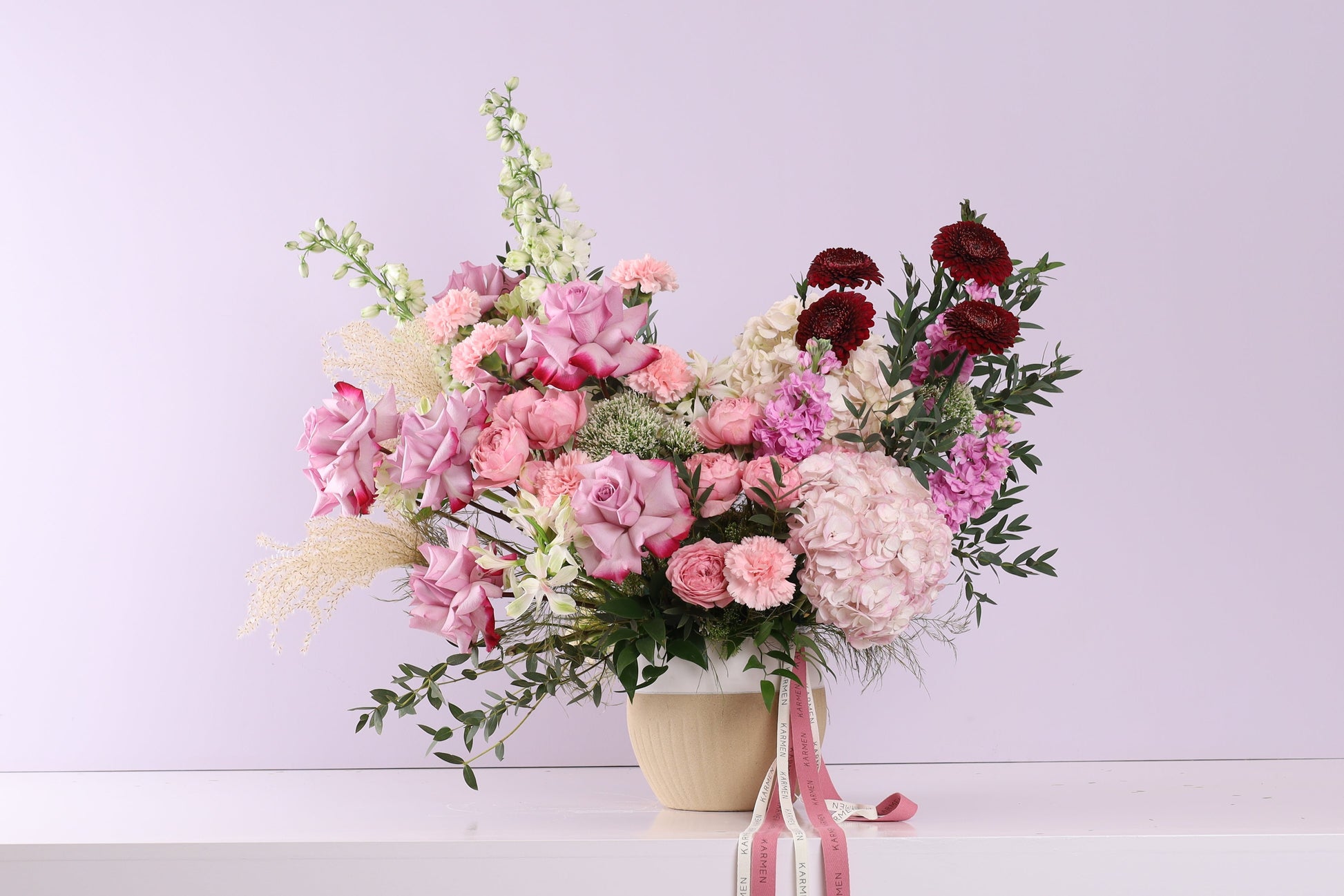 Rose Douceur - pink roses, hydrangeas and carnations in beige ceramic vase